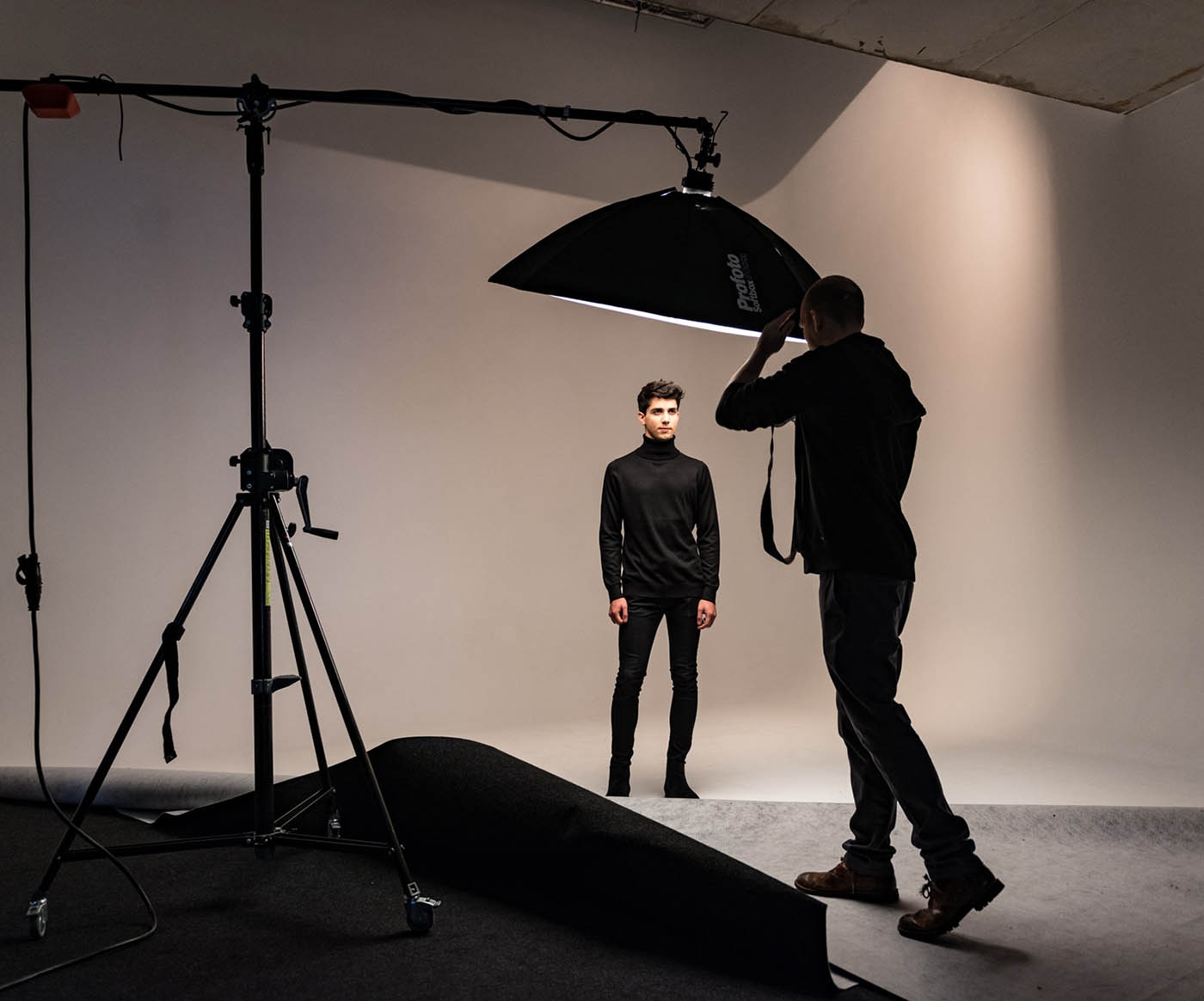 Studio scene. Model being photographed.